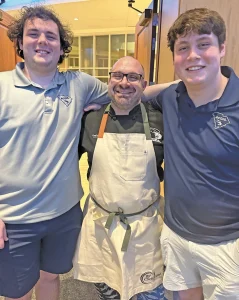 Father son bonding in restaurant kitchen on Isle of Palms, South Carolina 29464