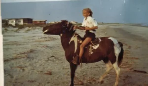 Historic photo of Alice Stender Powell riding her race horse on an Isle of Palms, South Carolina.