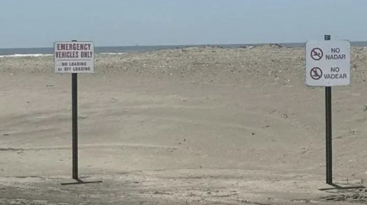 Beach signage, in English and Spanish, warning of Isle of Palms, SC's riptide.