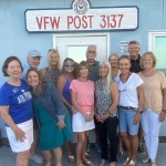 Members of VFW 3137 give gifts to IOPSC's EMS, IOPPD and IOPFD.