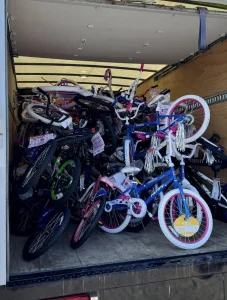 Looking at a lot of bikes piled into a U-haul truck.