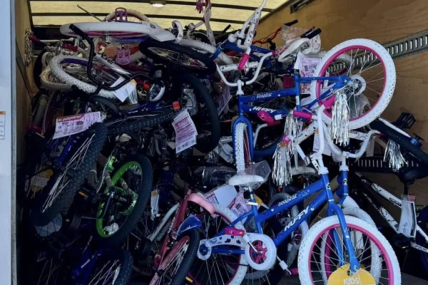 Looking at a lot of bikes piled into a U-haul truck.