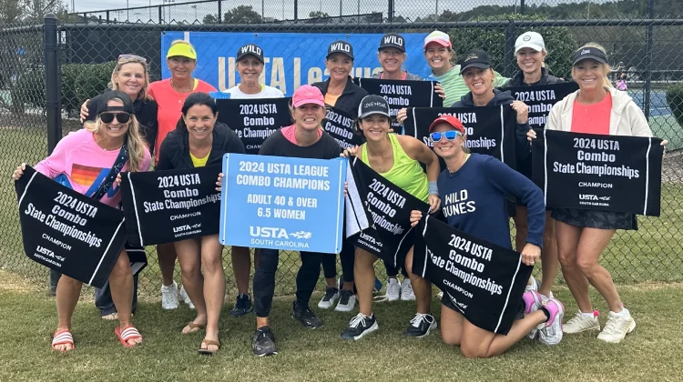 Wild Dune's women's tennis team showing off their South Carolina championship title.