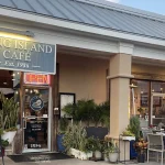 Front door and street sign for Long Island Cafe.