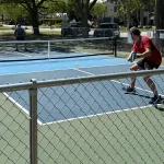 Two men playing a one-on-one game of pickleball on Isle of Palms Recreation Center's new pickleball court.