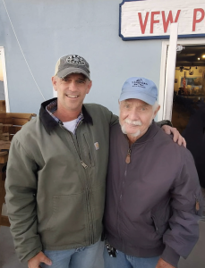 Two IOP male residents posing togethee and smiling