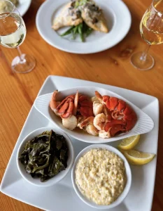 Two chef prepared seafood dinner plates at IOPSC's Boathouse restaurant. 