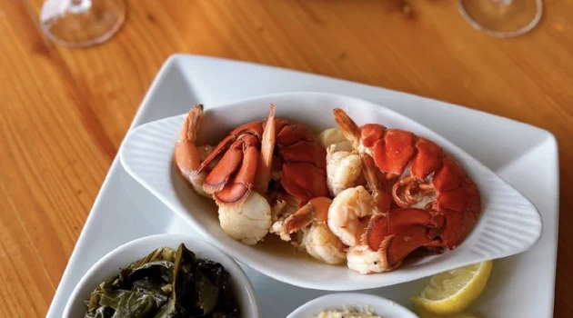 Two chef prepared seafood dinner plates at IOPSC's Boathouse restaurant.