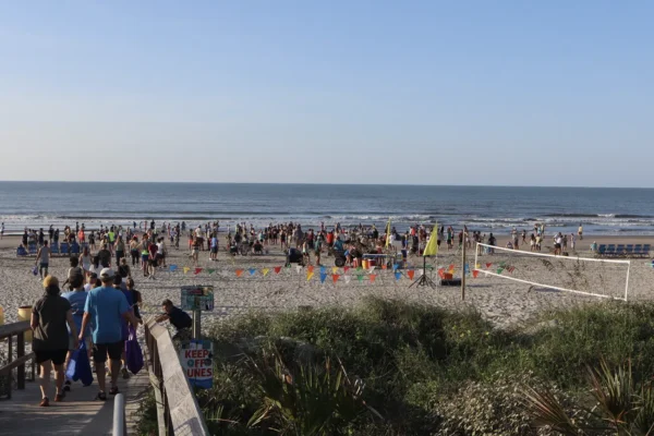 A widespread photo of the group of the runners participating in the Isle of Palms' Beach Run 2025.