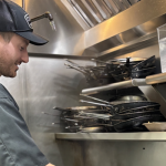 Jacob Mitzel using his culinary artistry skills in real-time.
