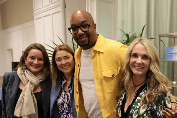 Author Kwame Alexander posing with fans at Wild Dunes' Author Event.