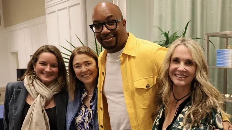 Author Kwame Alexander posing with fans at Wild Dunes' Author Event.