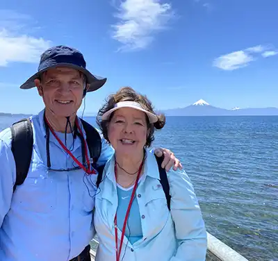 Bill and Pamela Marsh at Puerto Varas, Chile, with snowcapped Volcano Osorno in background. Photo provided.