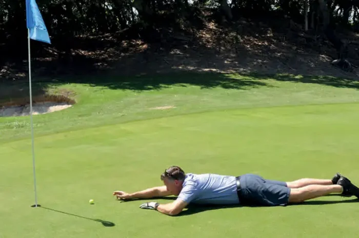 Golfer Jeff Jensen gets creative on the greens at the WDMGA’s annual PCF Golf Fundraiser.