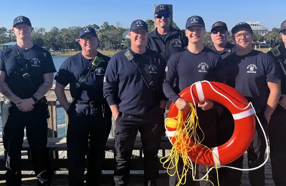 Isle of Palms Fire Department personnel promote water safety with a life ring newly donated from the Nestler family.