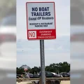 Parking Sign: No Overnight Boat Trailer Parking, EXCEPT IOP RESIDENTS.