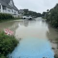 Looking down a flooded residential street on Isle of Palms, South Carolina.