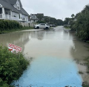 Looking down a flooded residential street on Isle of Palms, South Carolina.