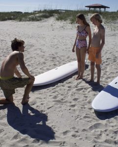 Brycen DePass IOP surfboard waxing instructuin.