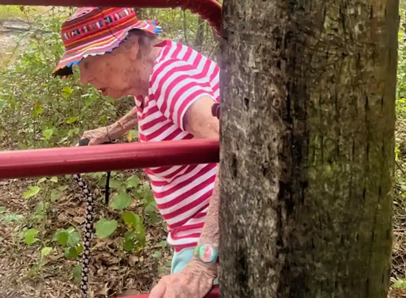 Ms. Kathryn Magruder on a nature walk, one of the ways she stays healthy after more than 100 years of life.