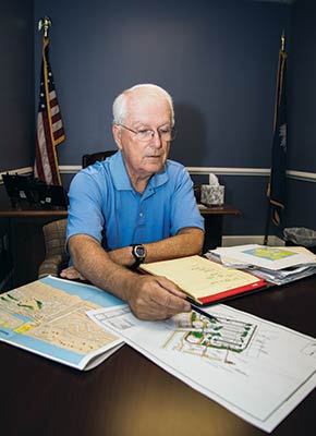 Mayor Dick Cronin looks over IOP Marina plans