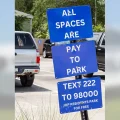 Parking Signs: All spaces are pay to park. Text 2222 to 98000. IOP residents park for free.