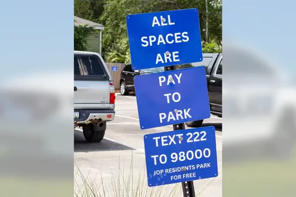 Parking Signs: All spaces are pay to park. Text 2222 to 98000. IOP residents park for free.
